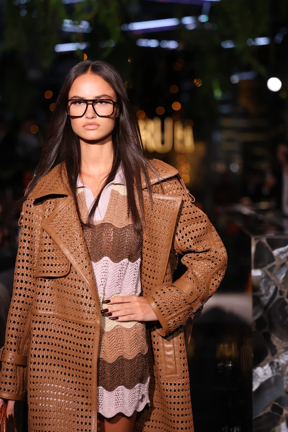 Brown crochet coat and boots against the mirrored set