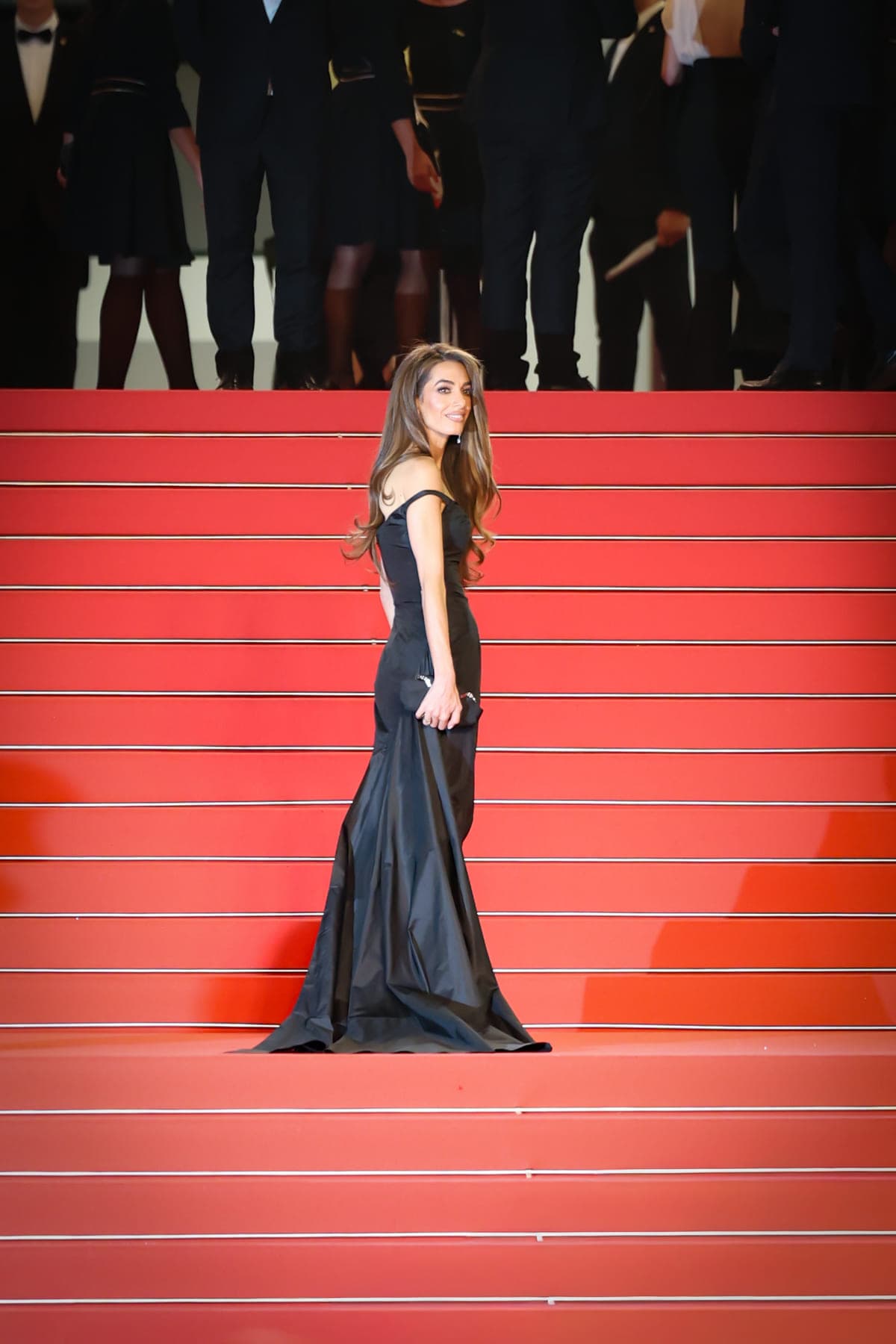 Black gown alone on the red carpet steps of the Palais, Cannes Film Festival