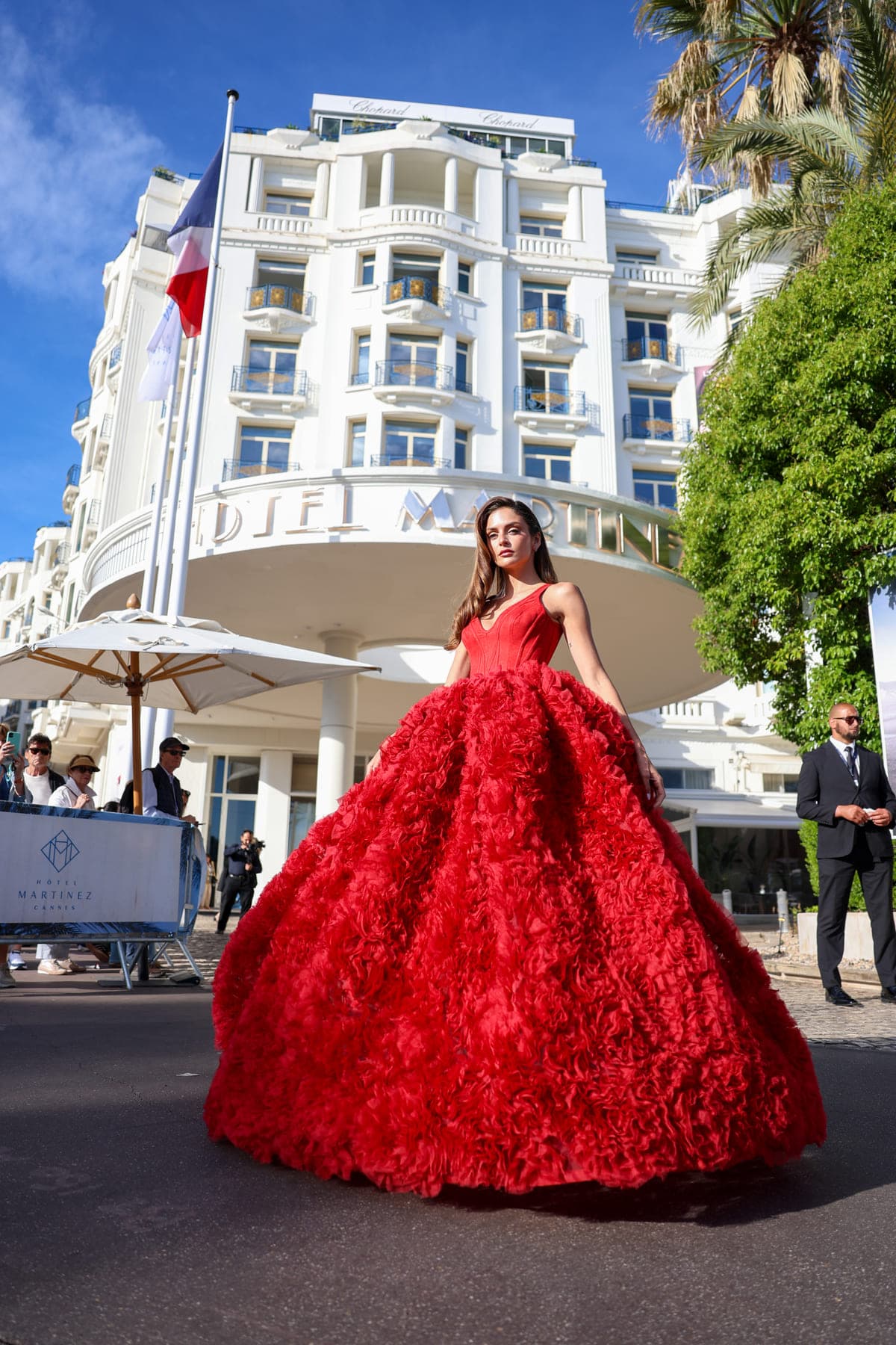 Red ballgown in front of the Hotel Martinez, Cannes