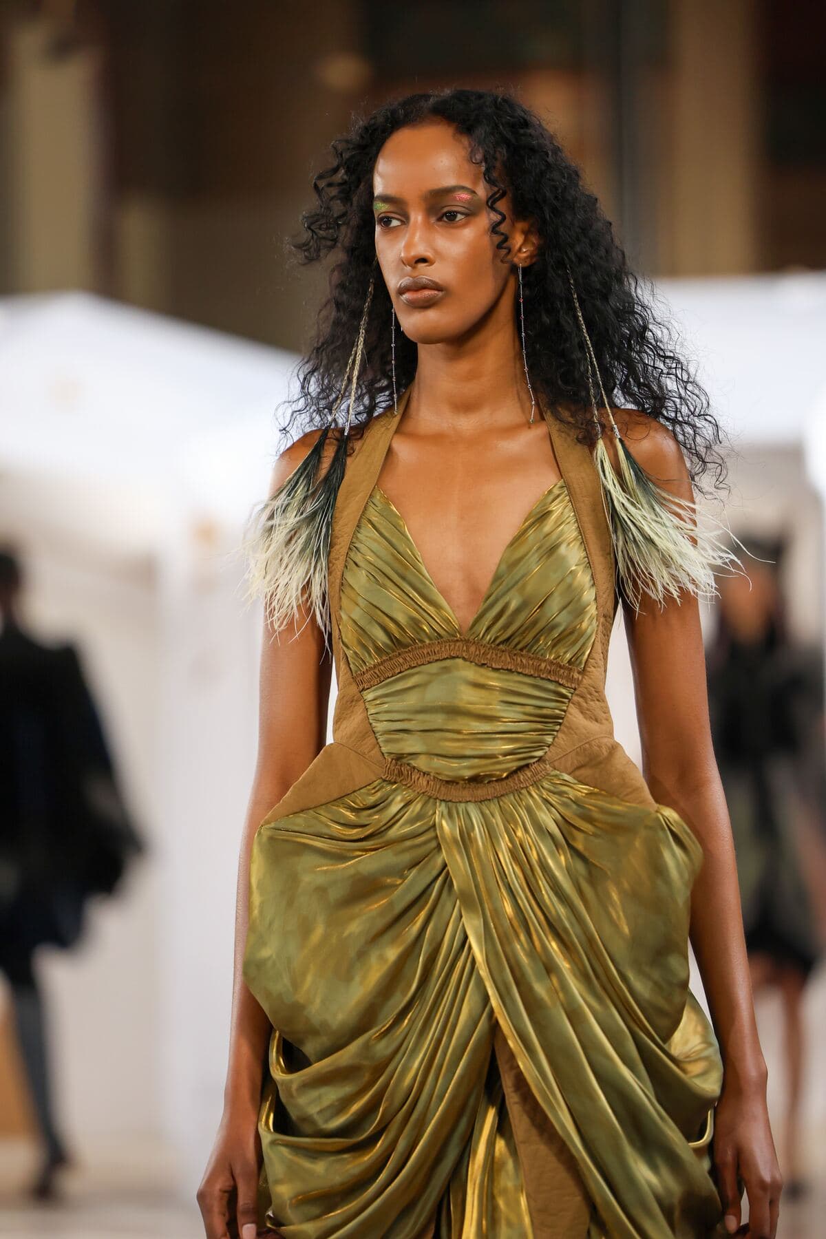 Gold draped gown on the Paris runway, Fashion Week March 2026