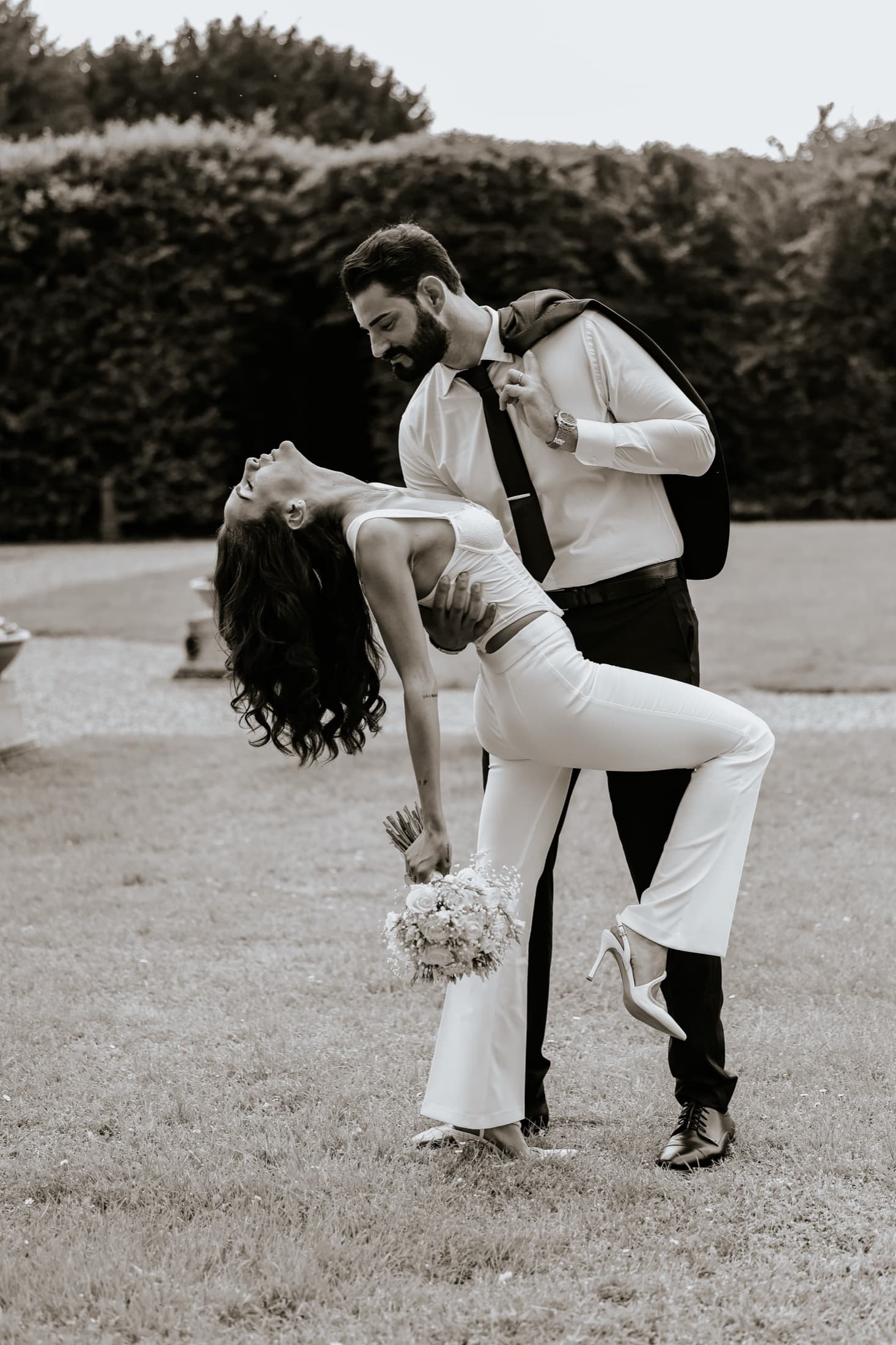 Bride and groom in an editorial dip, VT Weddings by Visual Twins